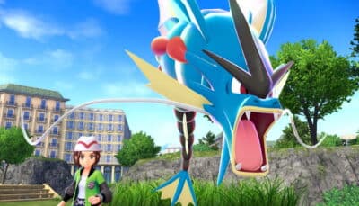 A trainer stands beside Gyarados in Pokémon Sword and Shield during a dramatic encounter in a city environment