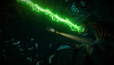 A glowing green energy beam cuts through a dark underwater environment in Submerged.
