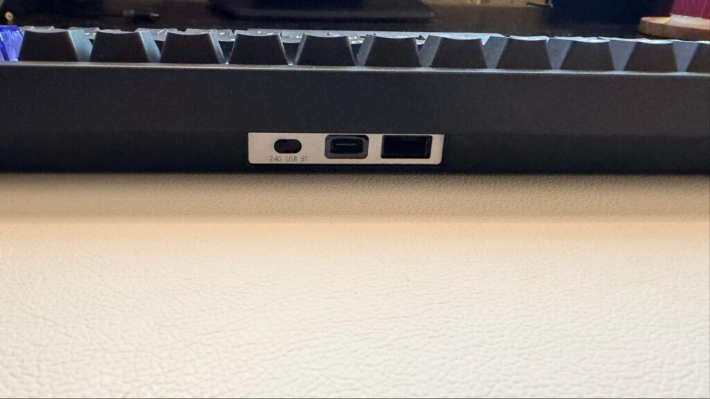 Side profile of the EPOMAKER Magcore65 Lite keyboard highlighting its slim plastic chassis, lightweight design, and rear connectivity ports for USB-C, Bluetooth, and 2.4GHz wireless use.