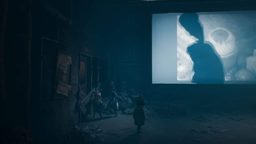 Reanimal のホラー アドベンチャーで、歪んだ巨大なモンスターのシルエットがスクリーンに現れる中、兄妹は廃墟となった映画館に隠れます。