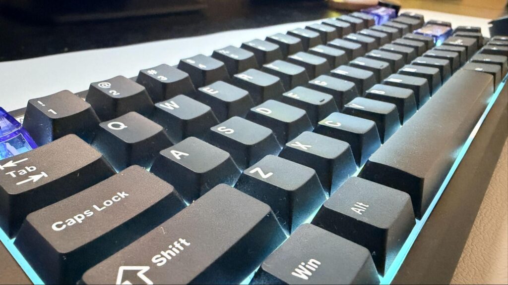 Angled view of the EPOMAKER Magcore65 Lite keyboard with illuminated mechanical keys, demonstrating its lightweight build and comfortable key spacing for long typing sessions.