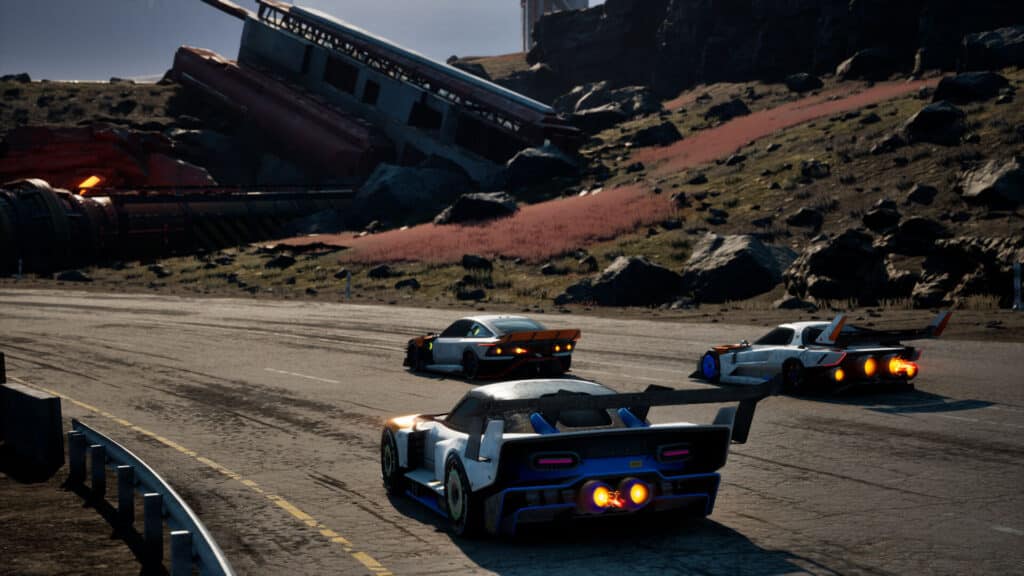 スクリーマーのオープントラックで疾走する3台のレーシングカー