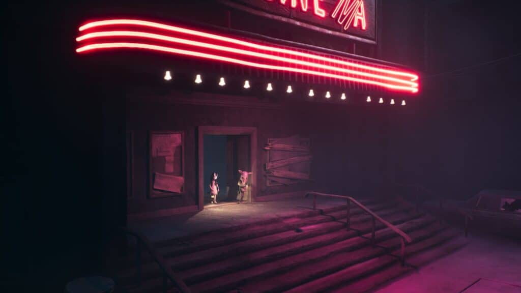 『Reanimal』では、雰囲気のある照明を演出した暗い廃墟の通りで、兄妹が赤く輝くネオンの映画館の看板の下に立っています。