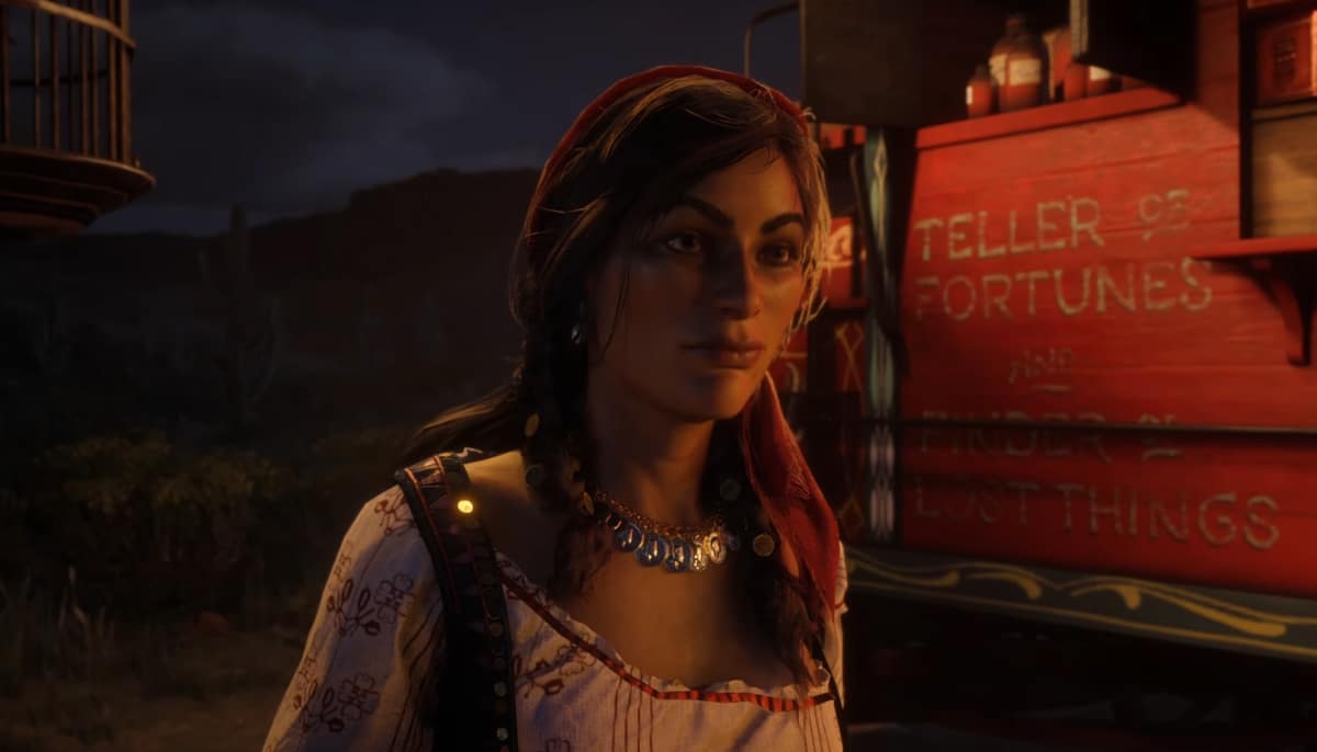 Madam Nazar standing beside her fortune teller wagon in Red Dead Online