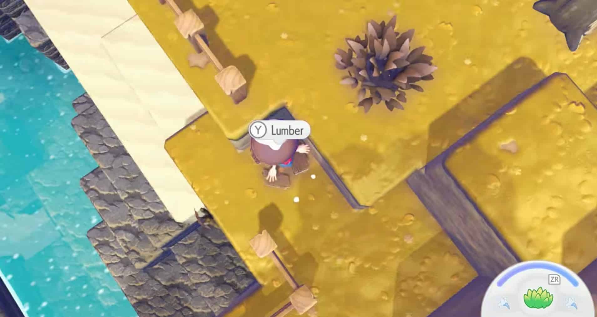 Top-down view of a cartoon-style video game character standing beside a wooden plank with an on-screen prompt reading “Y Lumber.” The character is positioned on a yellow terrain platform next to blue water and wooden posts connected by rails.
