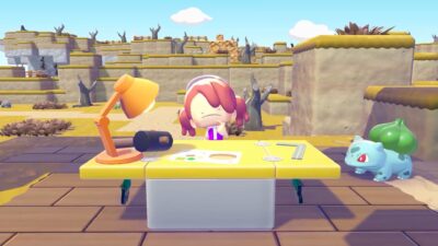 A stylized character sits at a yellow desk with tools and papers while a Bulbasaur stands nearby in a dry, rocky landscape in Pokémon Pokopia.